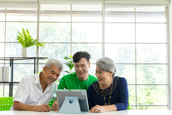 Family reviewing care options together on a tablet
