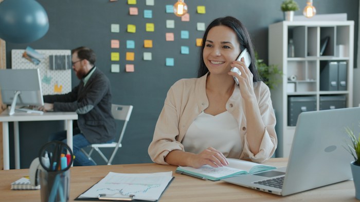Customer support specialist answering an employer's phone call